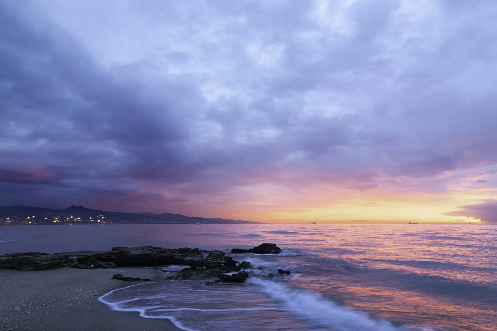 Soft evening light falling across a quiet coastline